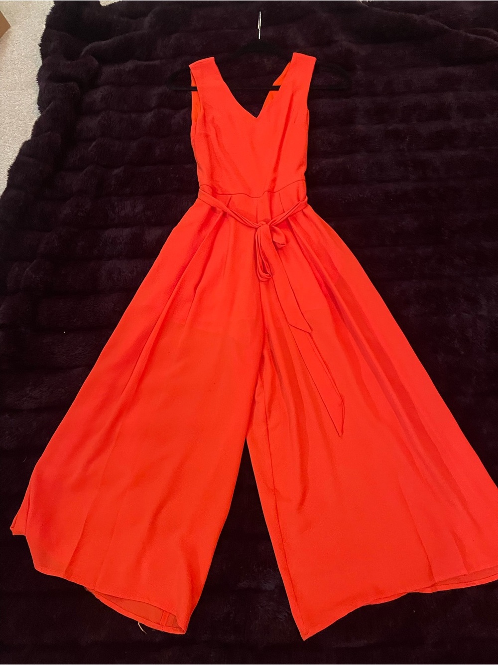 Sleeveless Red V‑Neck Wide‑Leg Jumpsuit with Self‑Tie Waist